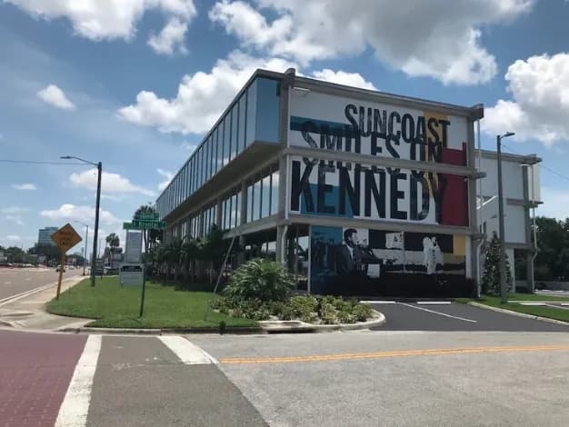 The Venture Center Building on Kennedy Boulevard, with large exterior murals across its upper floors