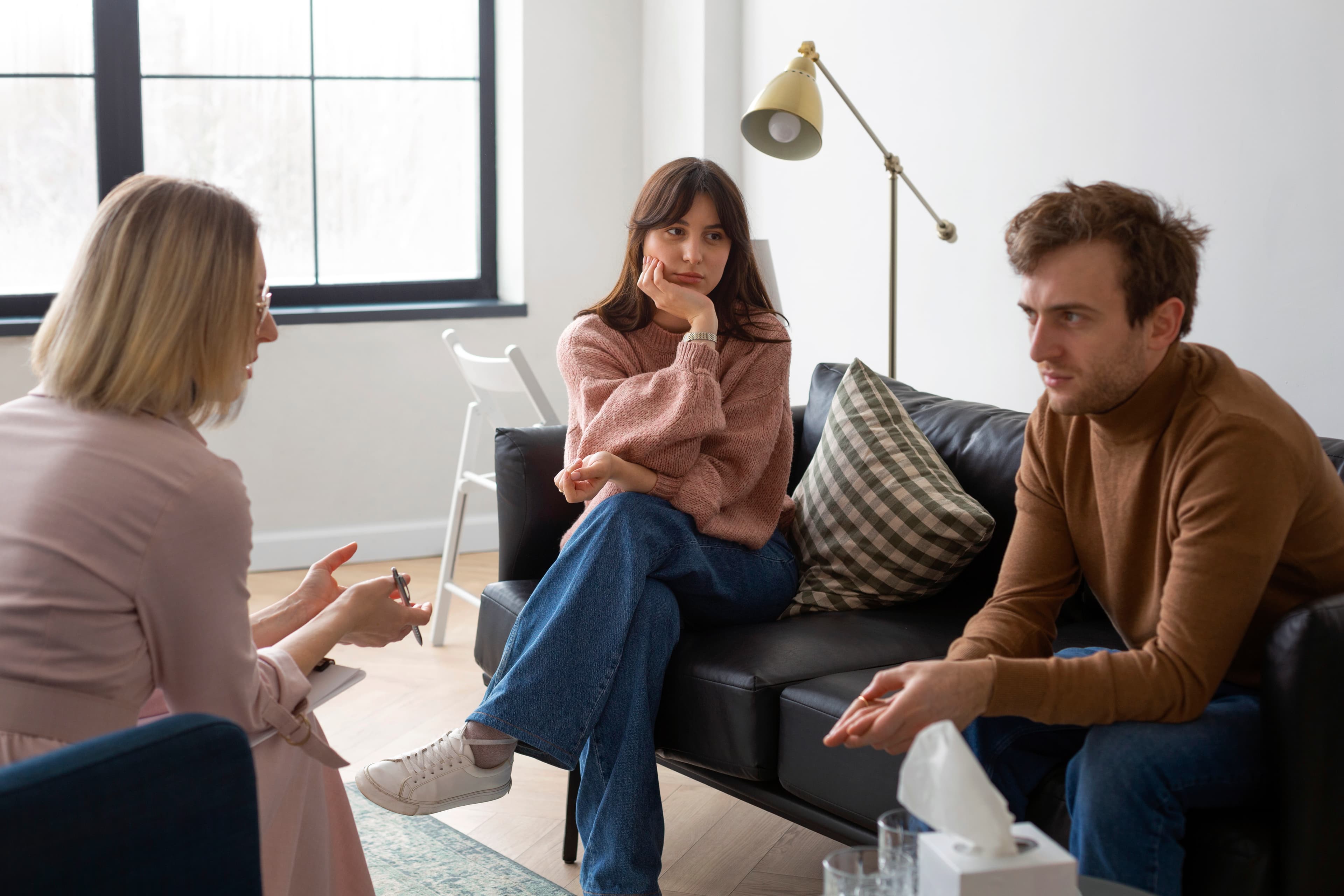 Two people in a calm, attentive therapy session