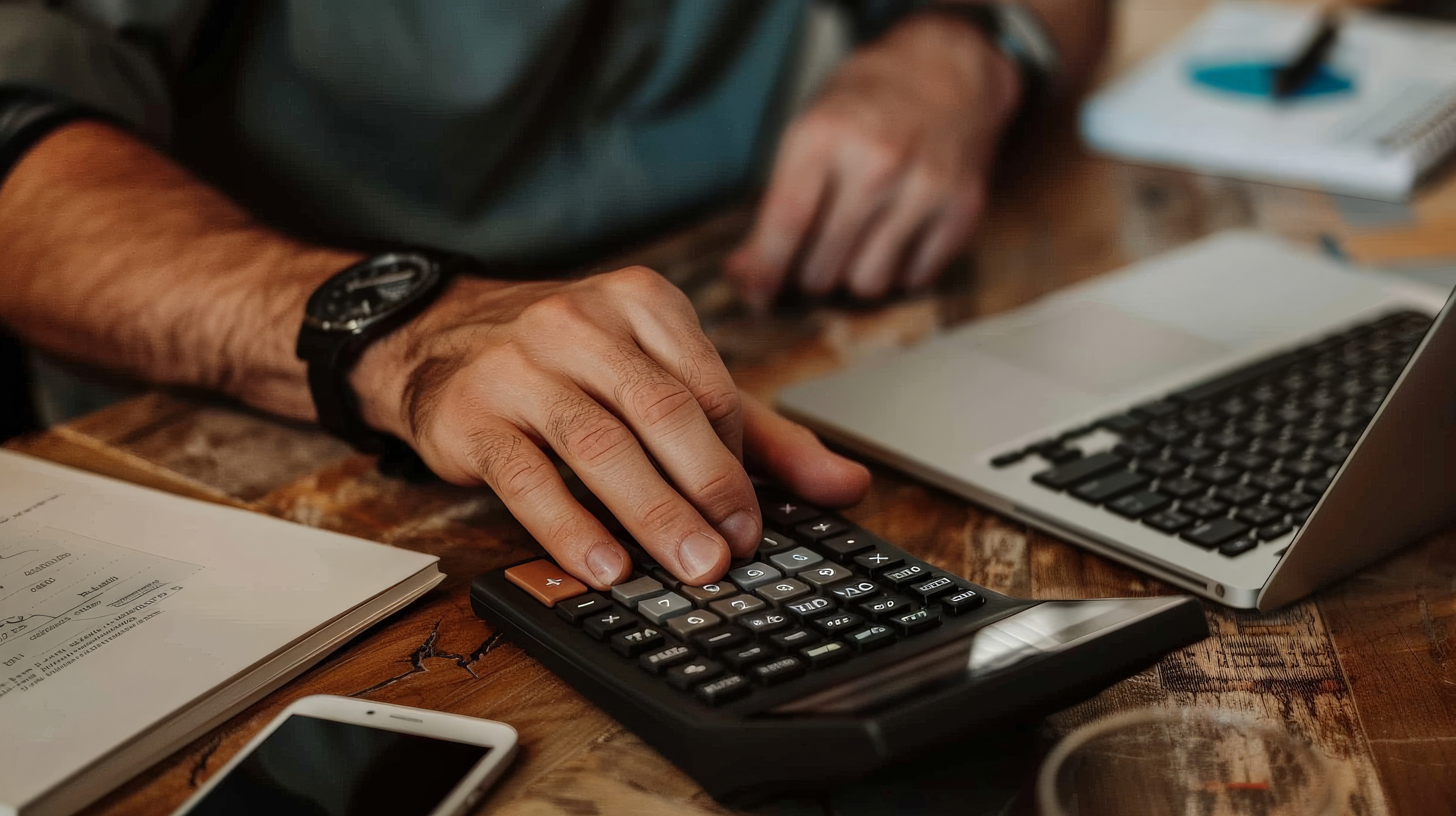 Person reviewing fees and financial planning at a desk